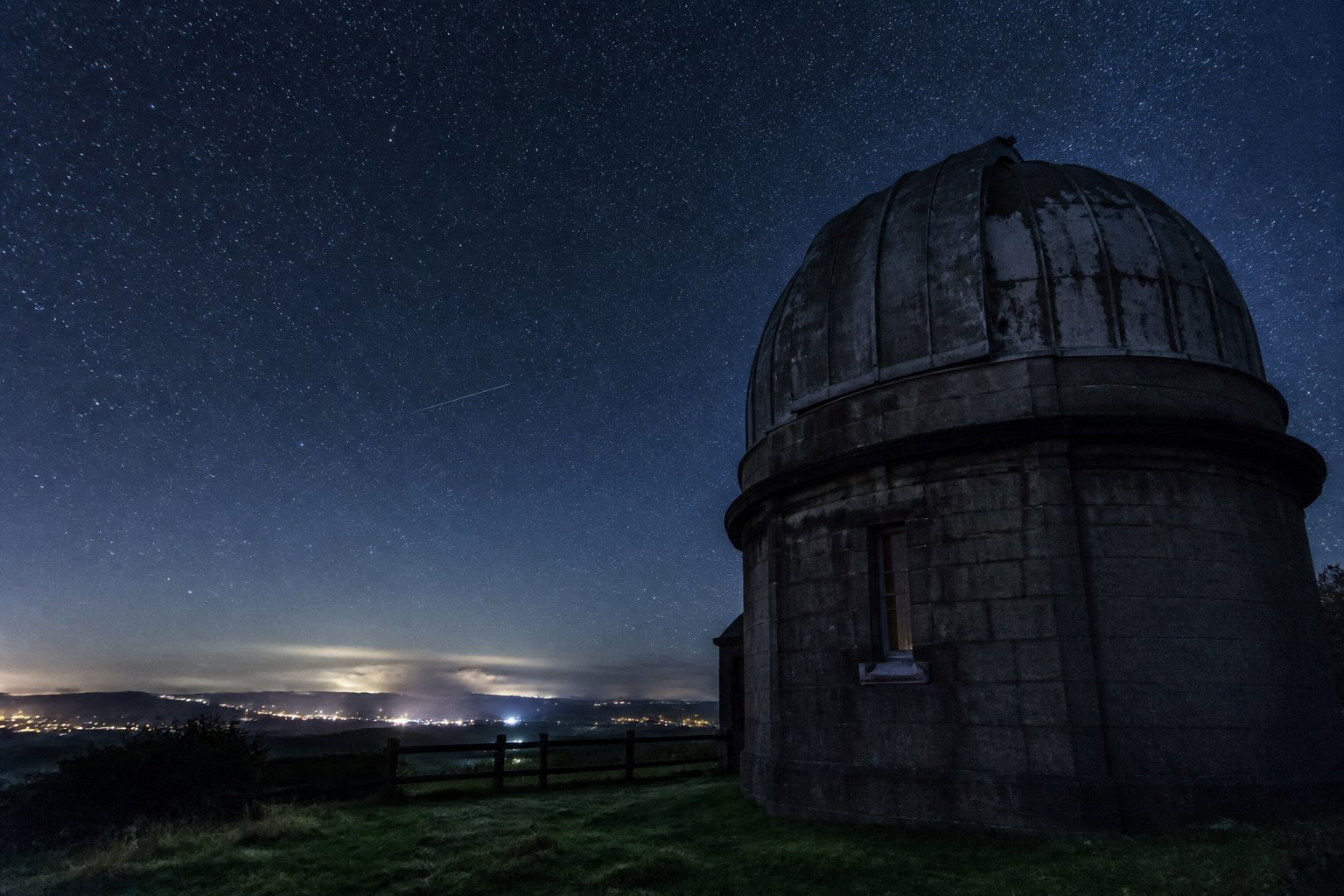 Observatory dome under stars
