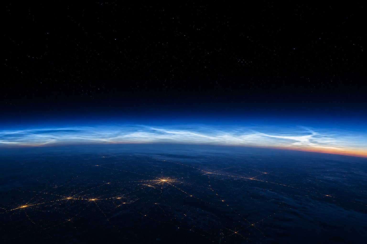 Earth limb showing a thin noctilucent layer at the edge of space